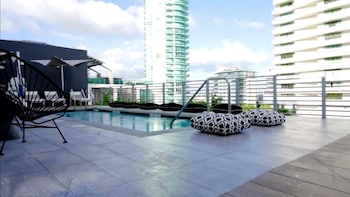 Outdoor pool, sun loungers at 6080 Design Hotel by Eskape Collection