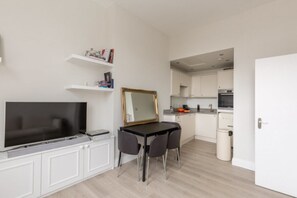 Apartment, 1 Bedroom | Living area | TV