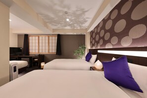 A hotel room with two beds, a television, a desk, and a traditional Japanese sliding door. - MARUTAMACHI Crystal Hotel (Kyoto)