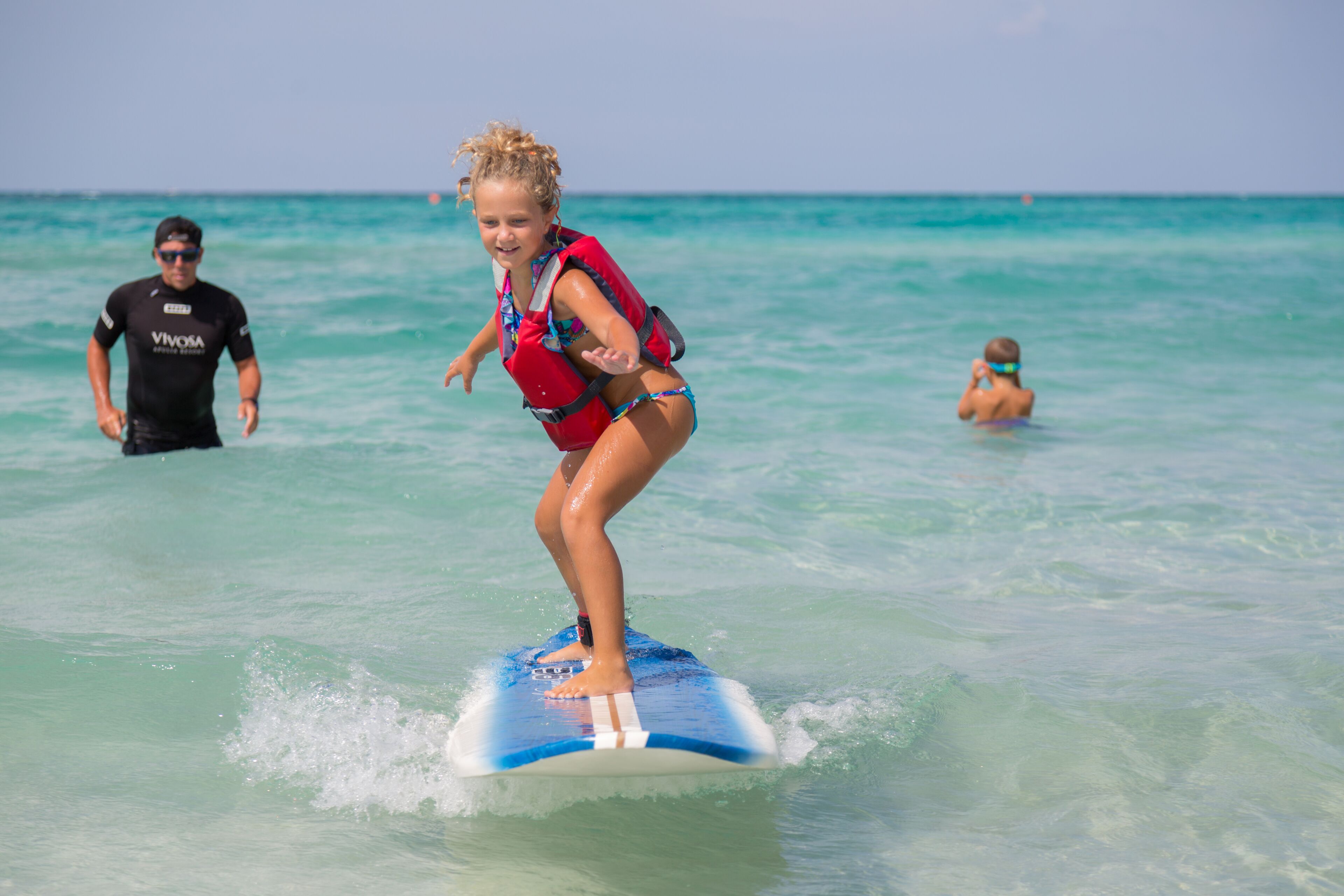 A person surfing on a clear day.