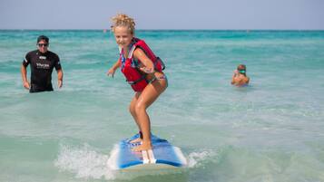 A person surfing on a clear day.