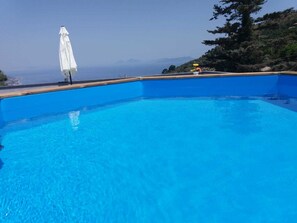 Seasonal outdoor pool, pool umbrellas, pool loungers
