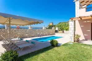 Outdoor pool, pool umbrellas, pool loungers