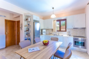 Luxury Villa (Villa Roumeli) | Private kitchen | Full-sized fridge, microwave, oven, stovetop
