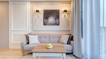 Deluxe Apartment, 1 Bedroom, Balcony, Courtyard View | Living area | 40-inch flat-screen TV with cable channels, Smart TV
