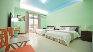 A hotel room with two beds, a desk, chairs, a TV, and a window with curtains. - Kinmen RuJia B&B (Jincheng)