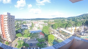 A panoramic view of a cityscape with buildings, roads, and greenery. - Sand Dreams Beach at Turtle Towers (Ocho Rios)