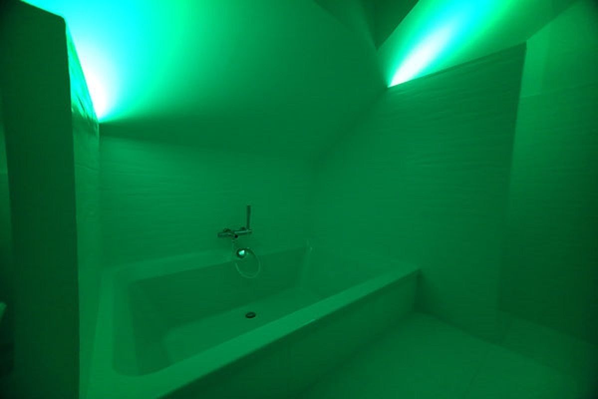 A bathroom with a bathtub, a shower, and a toilet.