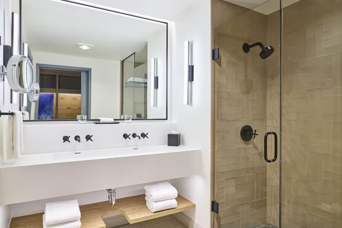 designer toiletries, hair dryer, bathrobes, slippers