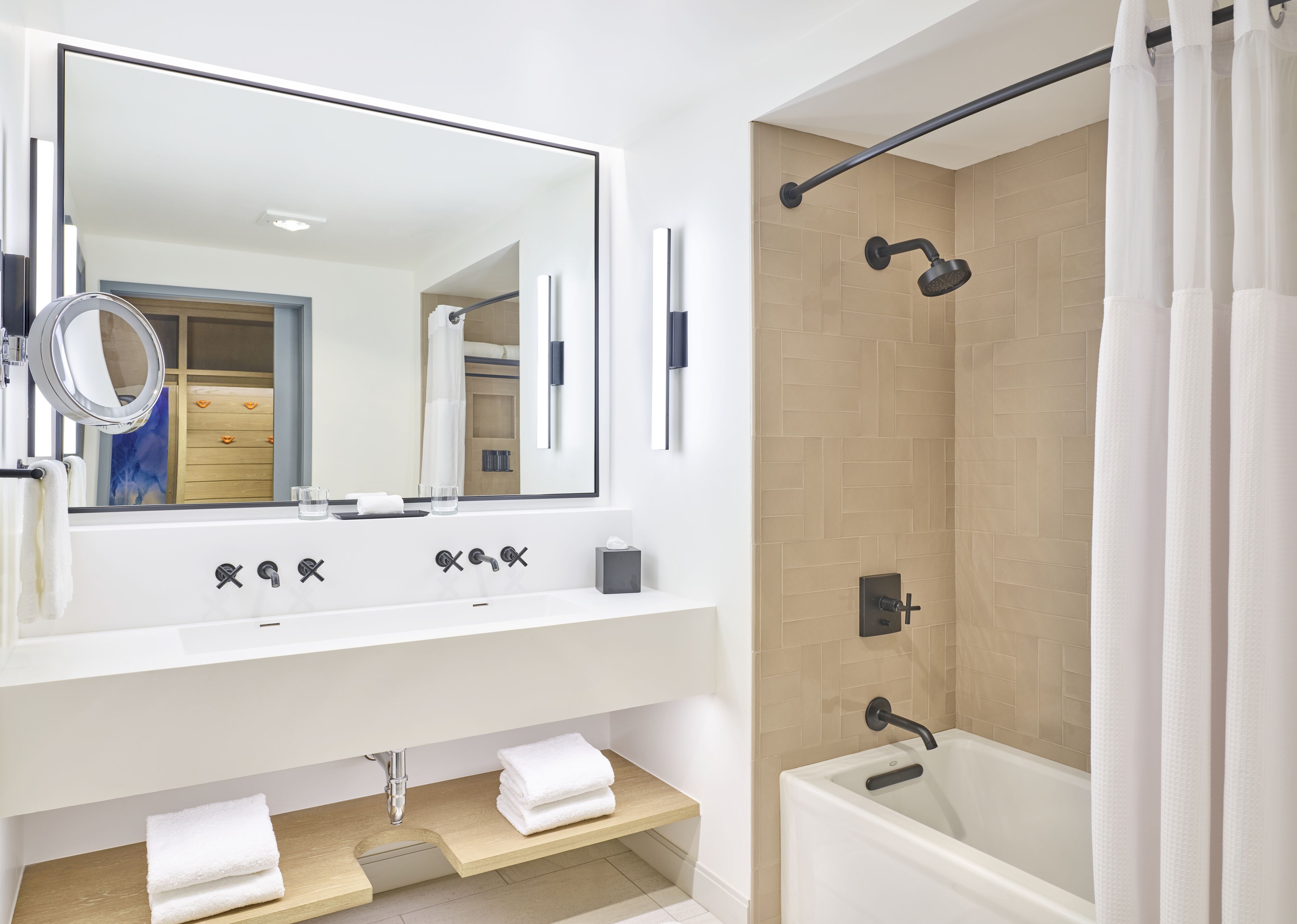 designer toiletries, hair dryer, bathrobes, slippers