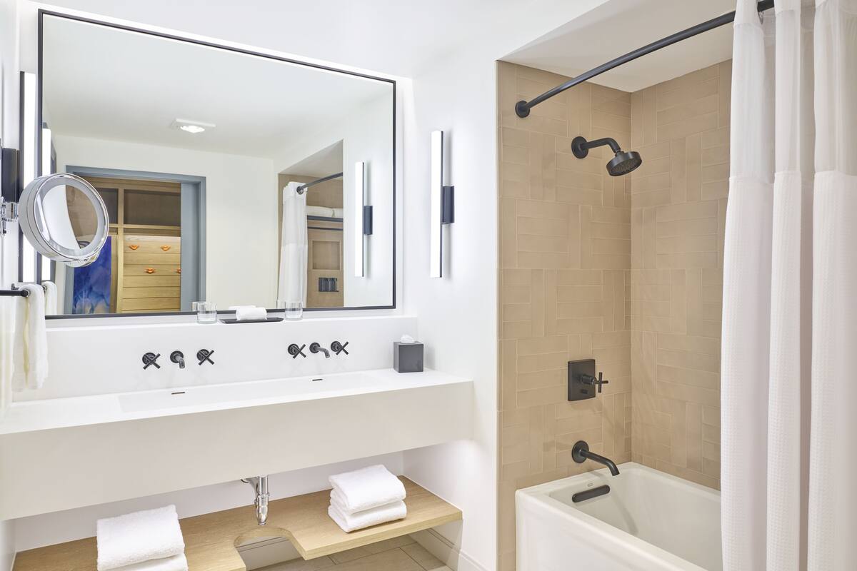 designer toiletries, hair dryer, bathrobes, slippers