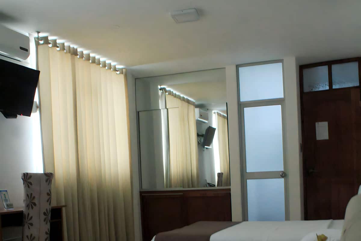 Premium bedding, down duvets, in-room safe, desk