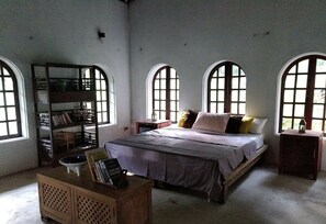 A room with a bed, a wooden cabinet, and a bookshelf. - The Ancient House (Hai Phong)
