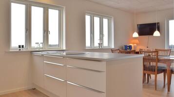 Fridge, stovetop, dishwasher, coffee/tea maker