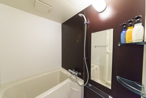 Separate bathtub and shower, deep-soaking bathtub, hair dryer, towels