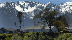 A mountain cabin with a view of snow-capped peaks. -  Best View in Port Angeles: The Bluff House  (Port Angeles)