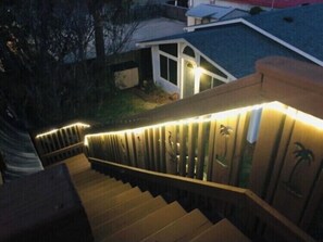 Staircase with modern design, featuring a series of steps and a handrail.