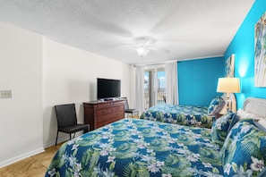 A hotel room with a bed, a TV on a dresser, a chair, and a balcony with a view. - BAM! Grand View of the Gulf of America! BEACH FRONT! JUST STEPS TO THE BEACH! 5⭐️ (Orange Beach)