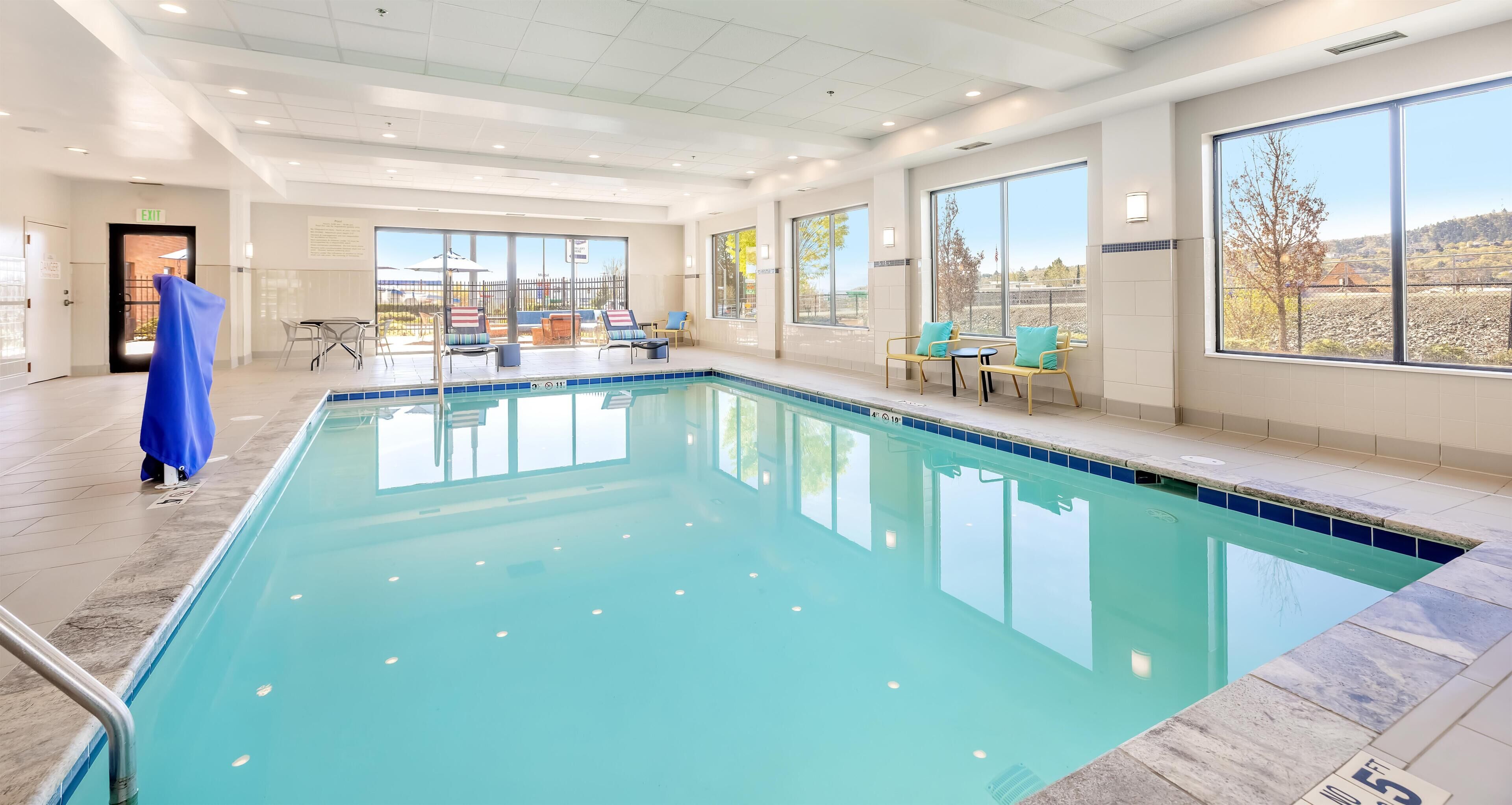 Indoor pool, open 6:00 AM to 10:00 PM, pool umbrellas, pool loungers