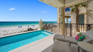 A pool area with a view of the beach and ocean. - SEA HIS LOVE: Destiny's Gulf Front Luxury Retreat: Infinity Pool, Elevator, Daily Maid Service! (Destin)