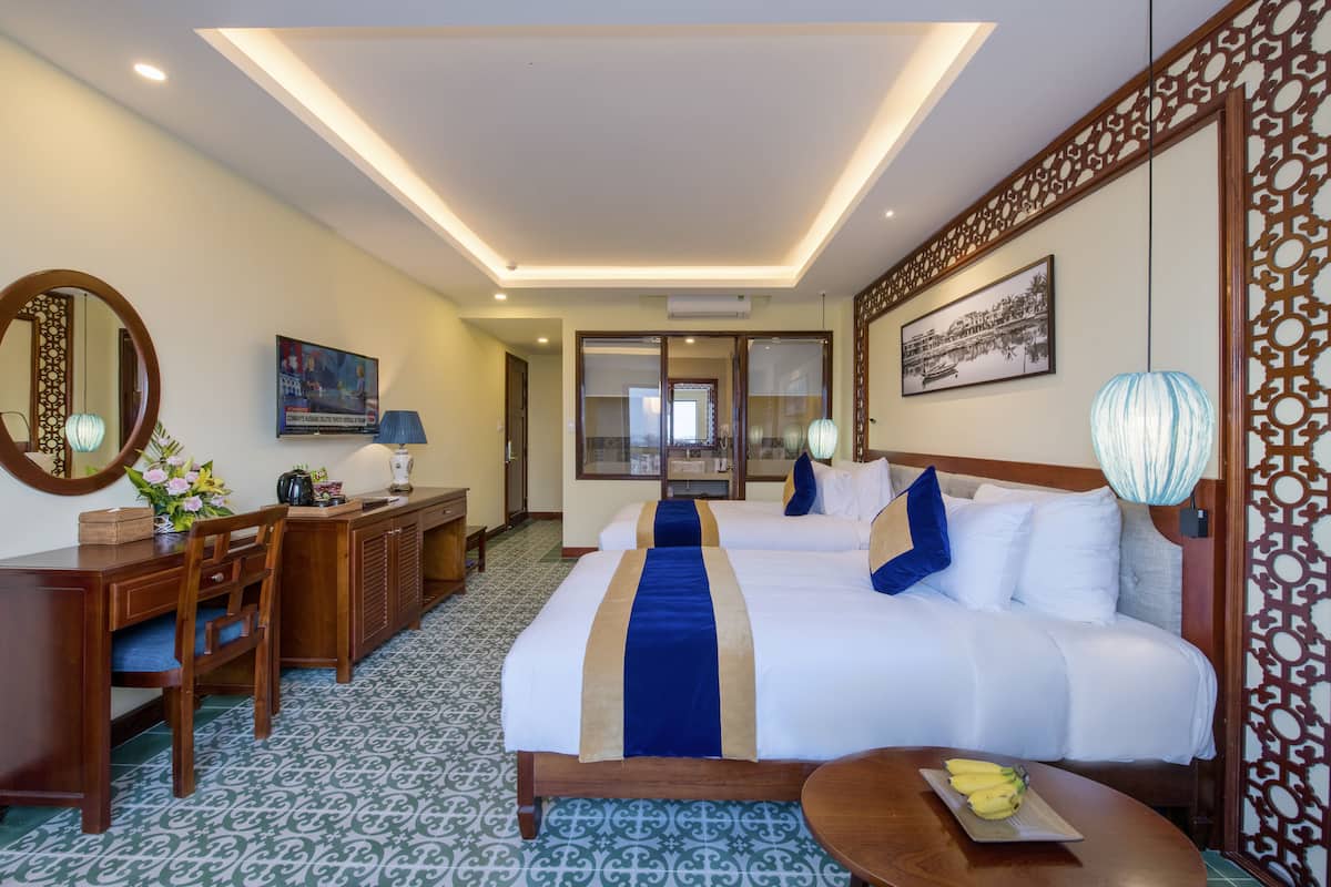 2 habitaciones, ropa de cama de alta calidad y minibar
