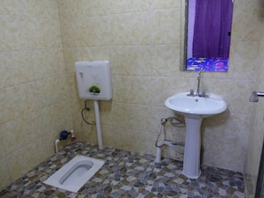 Shower, free toiletries, hair dryer, slippers