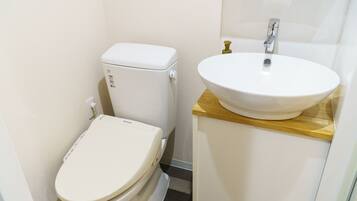 A small bathroom with a toilet and a sink.
