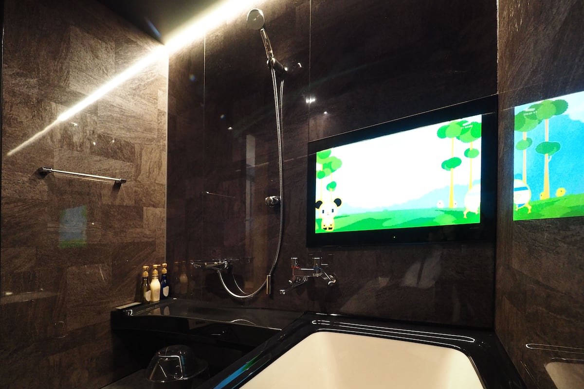 junior suite, private bathroom | bathroom | hair dryer, slippers, electronic bidet, towels