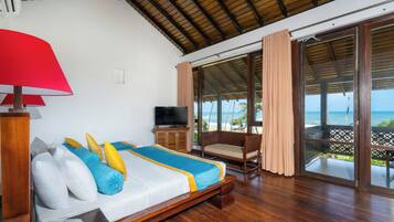 Suite, Ocean View | Living room | Flat-screen TV