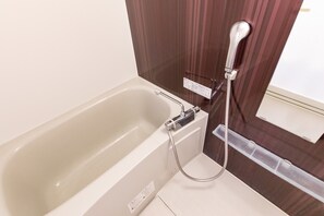 Basic Double Room | Bathroom | Separate bathtub and shower, deep-soaking bathtub, free toiletries - Condominium Likka in Nago (Nago)