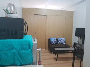 1 Bedroom Family Condo | Living area | Flat-screen TV - Simple Crib In Fairview Quezon City (Quezon City)