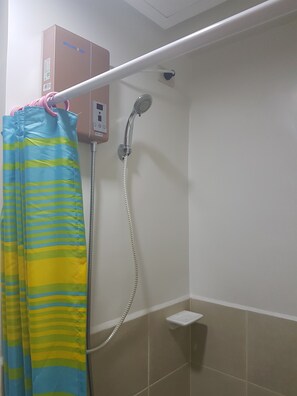 1 Bedroom Family Condo | Bathroom | Shower, free toiletries, hair dryer, towels - Simple Crib In Fairview Quezon City (Quezon City)
