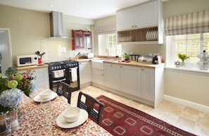 Ground Floor: Farmhouse kitchen with range cooker and belfast sink