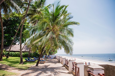 On the beach, white sand, beach towels, beach massages. Plaza Beach Hotel