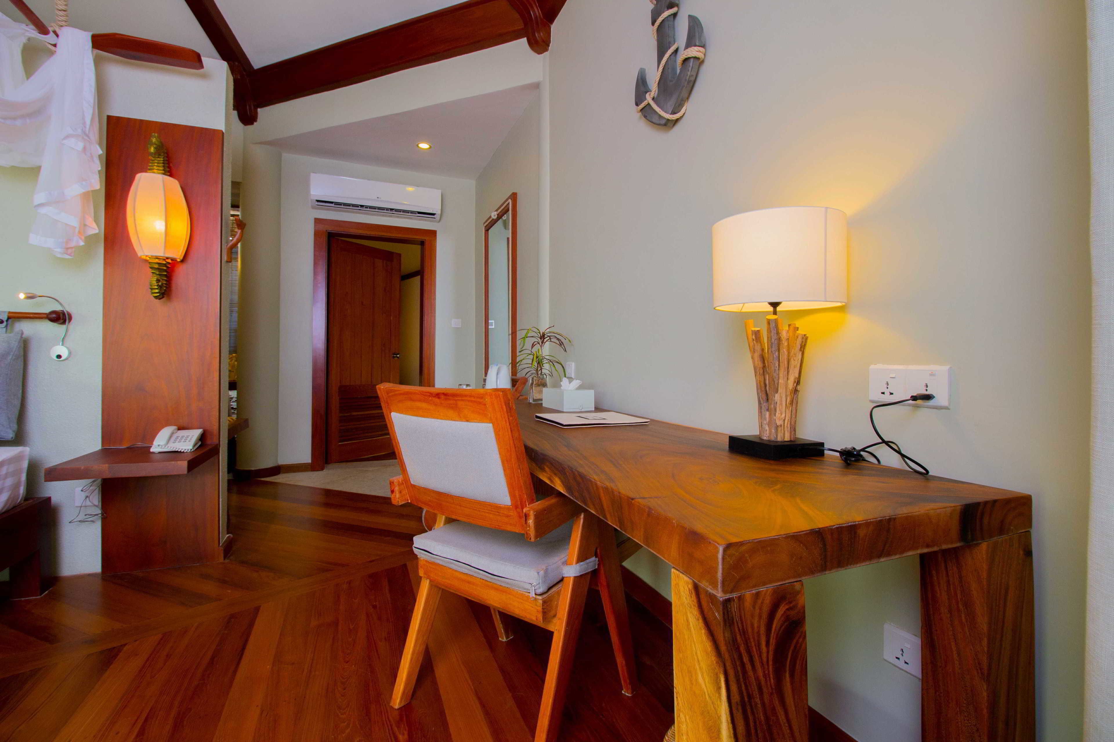 ngapali cottage with garden view | living area | flat-screen tv