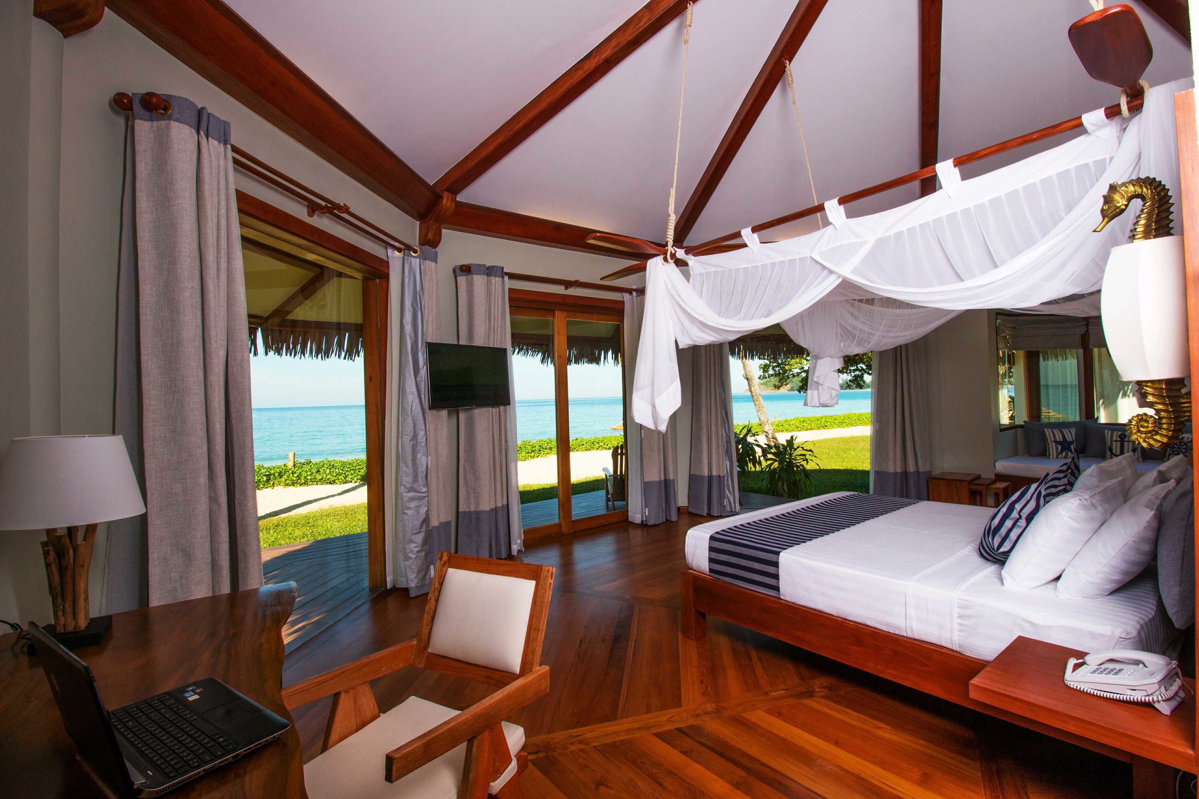mermaid suite with sea view, beachfront | minibar, in-room safe, desk, blackout curtains