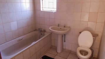 Standard Double Room, 1 Double Bed | Bathroom | Deep soaking tub, rainfall showerhead, free toiletries, hair dryer