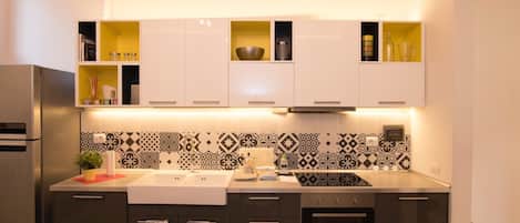 Departamento básico, 4 habitaciones | Cocina privada | Refrigerador, horno, parrilla de estufa y lavavajillas