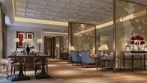 A hotel lobby with a modern ceiling design, a reception desk, and seating areas. - Sanyu Grand New Century Hotel (Wenzhou)