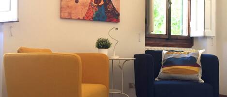 Basic Apartment, 4 Bedrooms | Living area | Flat-screen TV