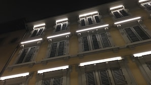 A multi-story building with multiple windows and a flat facade. - Zannetti (Florence)