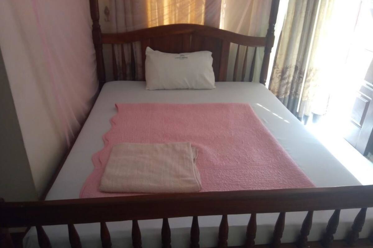 Desk, iron/ironing board (on request), bed sheets