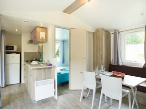 Fridge, microwave, coffee/tea maker, cookware/dishes/utensils