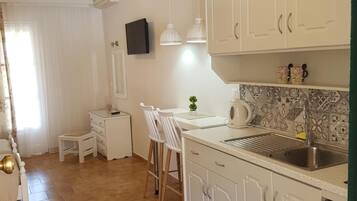 Fridge, stovetop, electric kettle, toaster