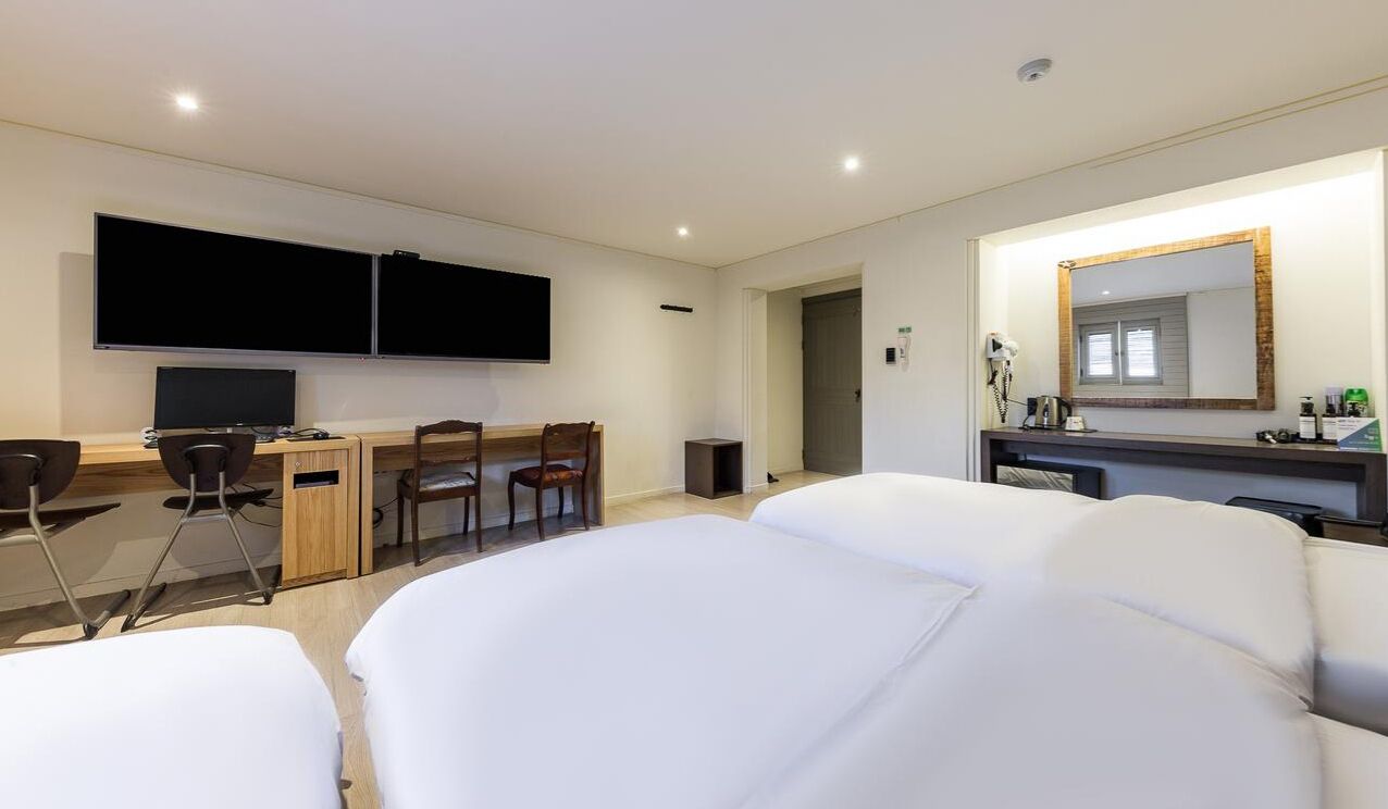 business triple room | premium bedding, down duvets, desk, laptop workspace