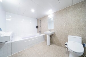 Business Twin Beds | Bathroom | Designer toiletries, hair dryer, bathrobes, slippers