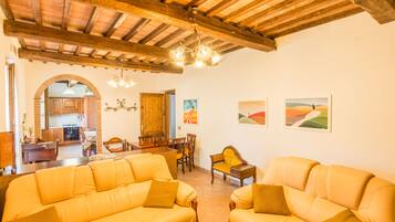 Classic Apartment, 3 Bedrooms | Living room | Flat-screen TV