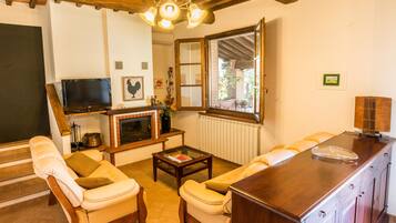 Classic Apartment, 3 Bedrooms | Living room | Flat-screen TV