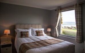 Minibar, desk, blackout curtains, iron/ironing board