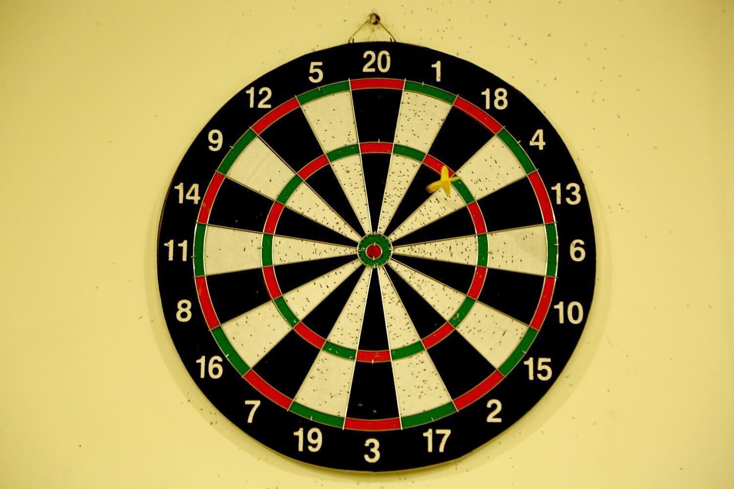 A dartboard with numbers and colored rings.